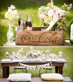 an old wooden crate is used as a picnic table with coca - cola bottles on it