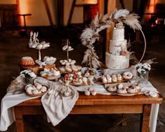 a table topped with lots of different types of food on top of a wooden table