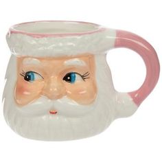 a ceramic santa claus mug with blue eyes