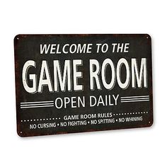 a metal sign that says welcome to the game room open daily, with an image of a