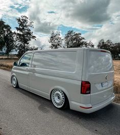 a silver van is parked on the side of the road