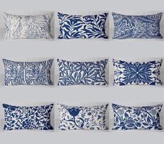 six blue and white pillows with different designs