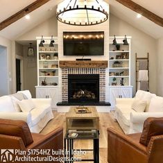 a living room filled with furniture and a flat screen tv mounted on the wall above a fireplace