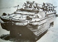 an old photo of a boat in the water with soldiers on it's back