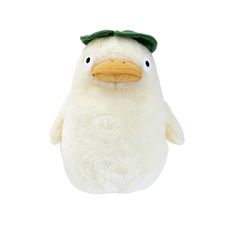 a white stuffed penguin with a green hat