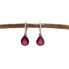 Dangly Pigeon Blood Red Ruby Drop Earrings in 14k Solid White Gold with Natural Diamond Accents | Pear Shape 10x8mm | July Birthstone Fine Jewelry Ruby Diamond Earrings, Ruby Diamond Earrings Fine Jewelry, Ruby Gemstone Diamond Earrings In Fine Jewelry Style, Ruby Diamond Earrings In Fine Jewelry Style, Ruby Gemstone Earrings Round Cut, White Gold Ruby Earrings With Prong Setting, Ruby Earrings With Prong Setting And Round Cut, Ruby Earrings With Prong Setting In Round Cut, Ruby Earrings With Round Cut And Prong Setting