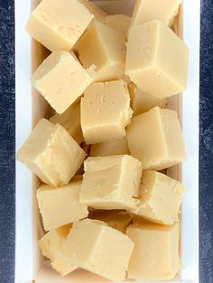 several cubes of cheese in a white box