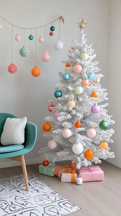 a white christmas tree decorated with colorful ornaments