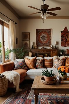 a living room filled with lots of furniture next to a large window and potted plants