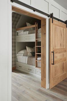 an open door leading to a bedroom with bunk beds