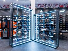 the inside of a shoe store with mirrored walls