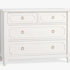 a white chest of drawers with gold handles and knobs on the bottom, against a white background