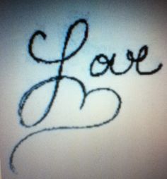 the word love is written in cursive writing