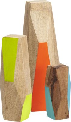 three wooden blocks with different colors on them