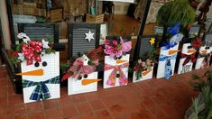 christmas decorations are displayed in front of a store