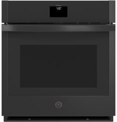 a black wall oven with its door open and the microwave on it's side