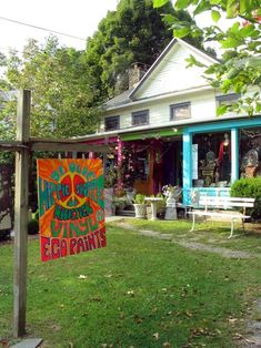 a sign in front of a house that says happy mother's day and celebrating