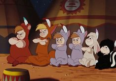 several cartoon characters sitting on the ground in front of a circus tent with an animal theme