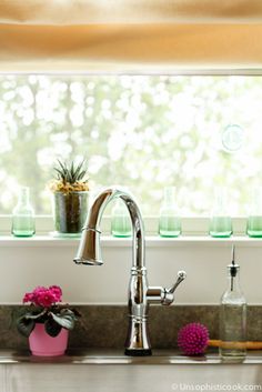 the kitchen sink is clean and ready to be used as a counter top or window sill