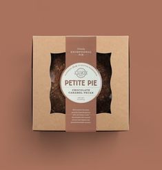 an open box of pie sitting on top of a green surface