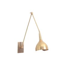 an old fashioned brass wall light on a white background