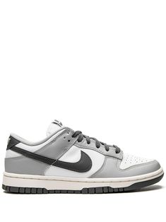 Dunk Low sneakers from NIKE featuring light grey, dark grey, white, leather, panelled design, signature Swoosh logo detail, perforated toebox, branded insole, flat rubber sole and front lace-up fastening. These styles are supplied by a premium sneaker marketplace. Stocking only the most sought-after footwear, they source and curate some of the most hard to find sneakers from around the world.. Gray Sneakers Nike, Sneakers That Go With Dresses, Mens Nike Dunks, Nike Dunks Men, Mens Dunks, Nike Dunks Grey, Womens Dunks, Dunks Men, Grey Dunks