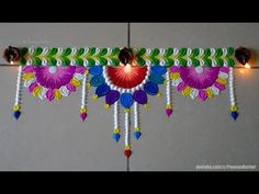 an artisticly decorated wall hanging with lights and beads on the sides, in bright colors