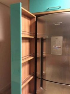 an open refrigerator in a kitchen with shelves