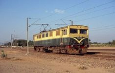 an old train is traveling down the tracks