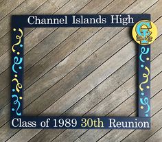 a blue and yellow frame with the name channel islands high class of 1939 30th reunion