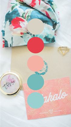 an assortment of items on a bed with the words hello written in different colors and shapes