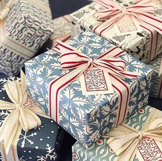 several wrapped presents are stacked on top of each other