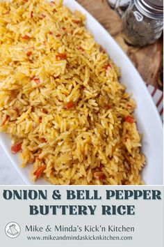 onion and bell pepper buttery rice on a white plate