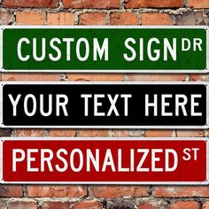 three street signs on a brick wall with the words custom sign dr and your text here are personalized