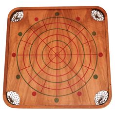 a wooden board with circles and dots in the center, on a white background photo