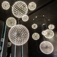 several circular lights hanging from the ceiling in a building