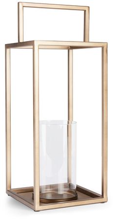 a candle holder with a glass inside and gold frame around it on a white background