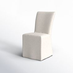 a white chair sitting on top of a white floor