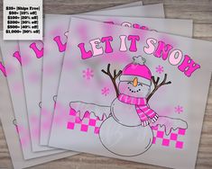 three snowmen with pink hats and scarfs are shown in front of the words let it snow