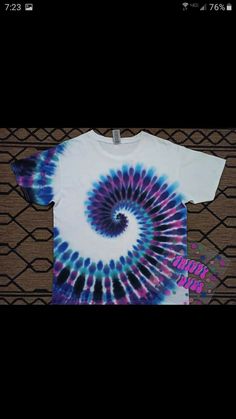 a t - shirt with a spiral design on it