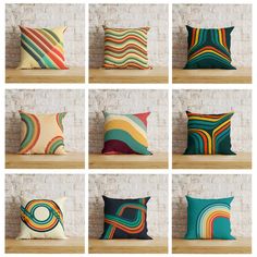 many different colored pillows sitting on top of a wooden shelf