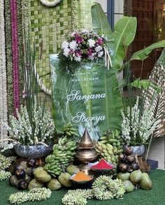 an arrangement of tropical plants and flowers on display