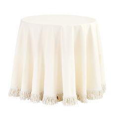 a white table cloth with tassels on it