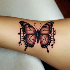 a butterfly with musical notes on it's arm