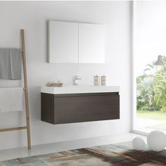 a bathroom with a ladder, sink and mirror on the wall next to a window