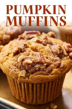 a close up of a muffin on a plate with the words pumpkin muffins