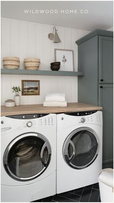 Add a touch of elegance to your home with this laundry room with sage green cabinets by Wildwood Home Co. The floating shelves & laundry room cabinets provide ample storage space, while the modern laundry room design elements create a fresh & inviting atmosphere. Explore laundry mud room ideas & get inspired for your next laundry room remodel. Visit Wildwood Home Co at wildwoodhomecompany.com to see our full service residential architect & interior design studio & curated shop of homewares. Modern Laundry Room Design, Cabinets And Open Shelving, Sage Green Cabinets, Laundry Remodel, Modern Laundry Room, Grey Laundry Rooms, Modern Tudor, Green Laundry, Black Floor Tiles