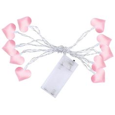 pink hearts with white string and tags attached to the strings, on a white background