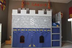 a child's bedroom with a castle bed in the middle and other decorations on the walls