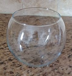 a clear glass bowl sitting on top of a counter